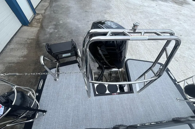 Slide: The Image of 2025 Harris Solstice 230 boat with sleek metal railings and modern outboard motor. - 15