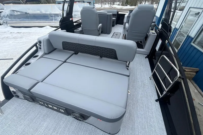 Slide: The Image of 2025 Harris Solstice 230 pontoon boat interior with gray seating and modern design. - 16