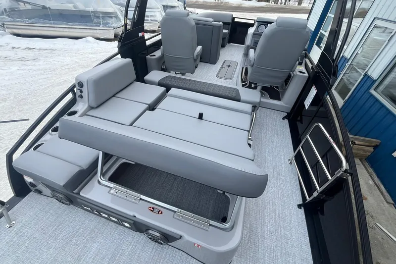 Slide: The Image of 2025 Harris Solstice 230 boat interior with gray seating and modern design. - 20