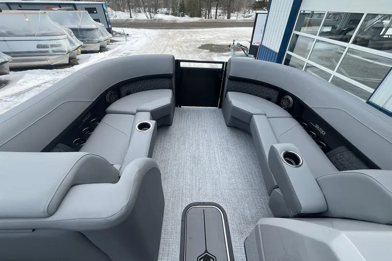 Slide: The Image of 2025 Harris Solstice 230 pontoon boat interior with luxurious gray seating and cup holders. - 24