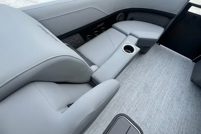 Slide: The Image of Luxurious interior of 2025 Harris Solstice 230 boat with plush seating and cup holder. - 25