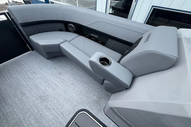 Slide: The Image of 2025 Harris Solstice 230 boat interior with gray seating and cup holders. - 26