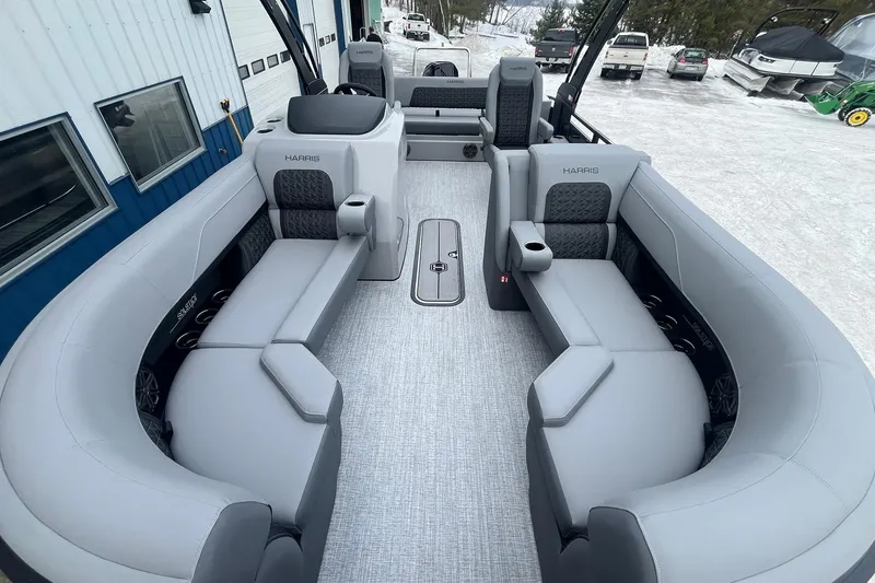 Slide: The Image of 2025 Harris Solstice 230 pontoon boat interior with luxurious gray seating and modern design. - 8