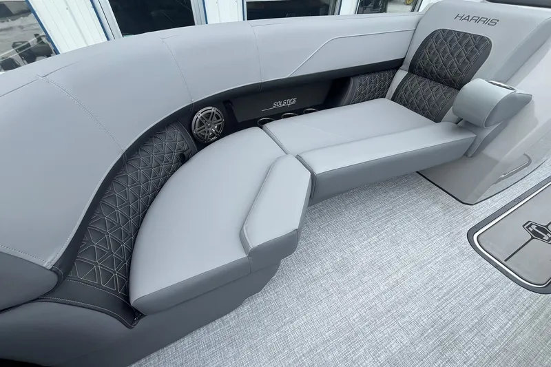 Slide: The Image of Luxurious seating on 2025 Harris Solstice 230 boat with elegant gray upholstery. - 9