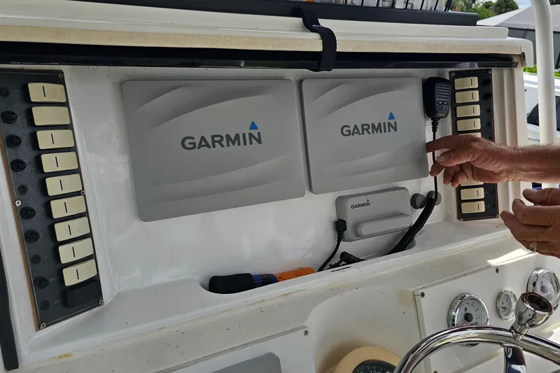 Slide: The Image of Control panel of a 1993 Marlin 350 Sportfish with Garmin navigation equipment. - 16