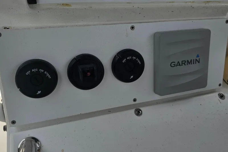 Slide: The Image of Control panel of a 1993 Marlin 350 Sportfish with Garmin device. - 17