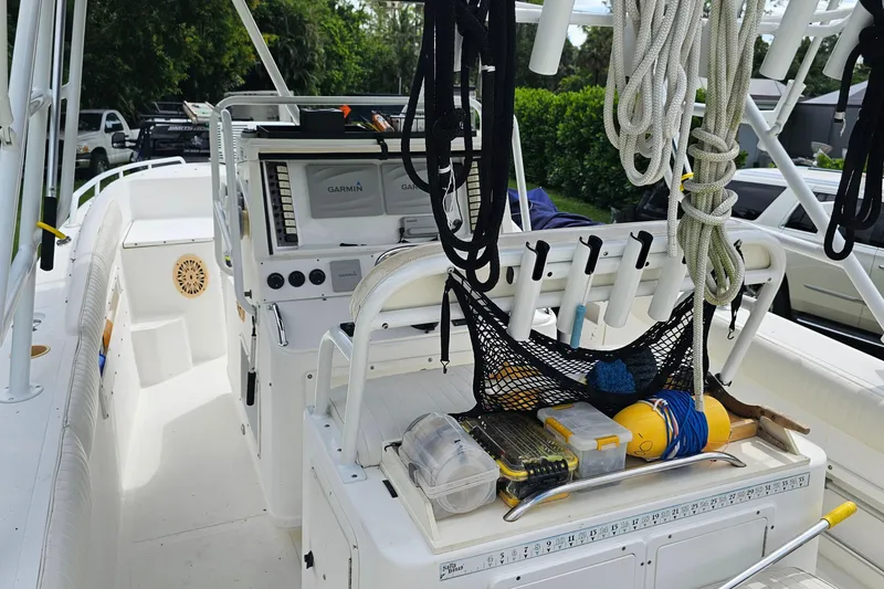 Slide: The Image of 1993 Marlin 350 Sportfish boat deck with fishing gear and ropes. - 22