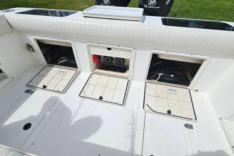 Slide: The Image of 1993 Marlin 350 Sportfish boat deck with open storage compartments. - 27