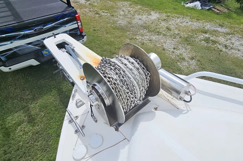 Slide: The Image of Winch on 1993 Marlin 350 Sportfish boat, parked near a Ford truck. - 31