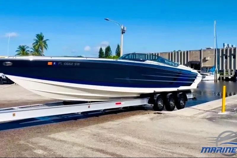 The Image of 2019 Formula 382 FASTech boat on trailer at marina, clear sky background. - 0