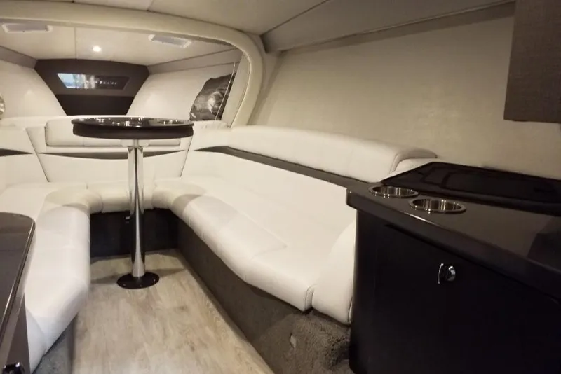 Slide: The Image of Luxurious interior of 2019 Formula 382 FASTech boat with white seating and table. - 11