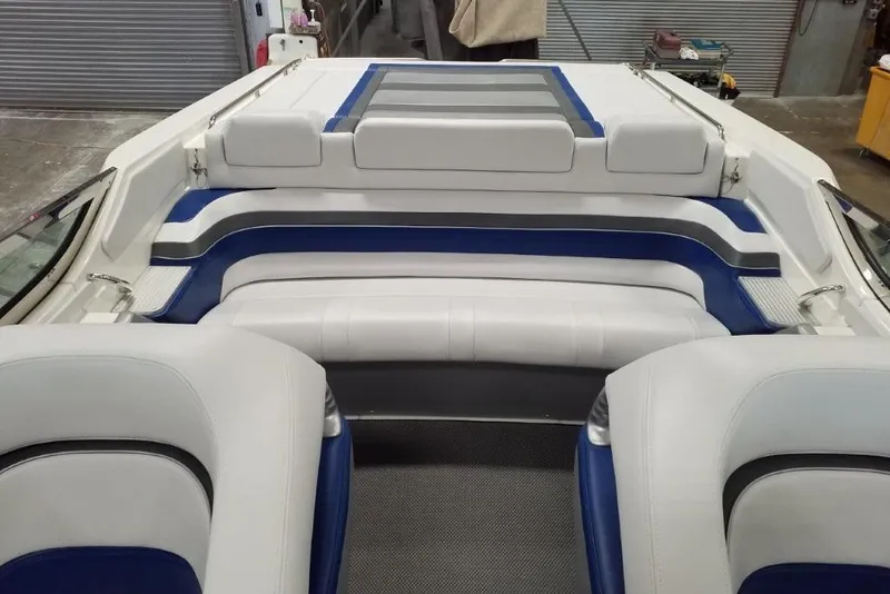 Slide: The Image of 2019 Formula 382 FASTech boat interior with white and blue seating. - 21