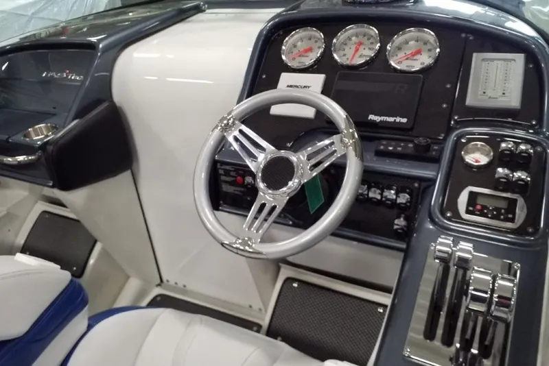 Slide: The Image of 2019 Formula 382 FASTech boat cockpit with steering wheel and control panel. - 22