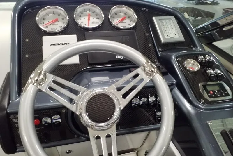 Slide: The Image of 2019 Formula 382 FASTech dashboard with steering wheel and gauges. - 23