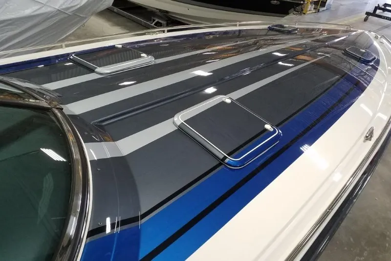 Slide: The Image of 2019 Formula 382 FASTech boat with sleek blue and gray striped design. - 4