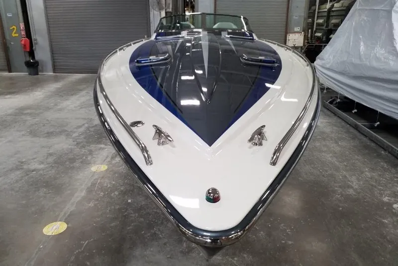 Slide: The Image of 2019 Formula 382 FASTech boat in a storage facility, showcasing sleek design and vibrant colors. - 5
