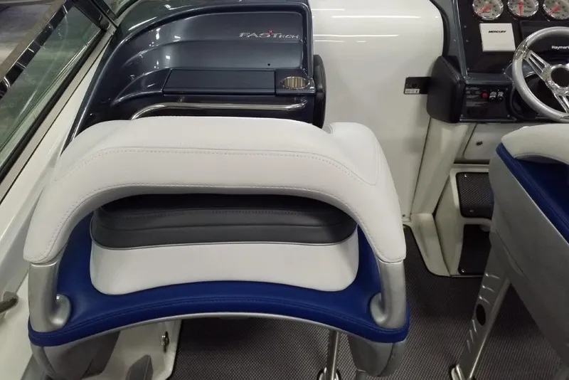 Slide: The Image of 2019 Formula 382 FASTech boat interior with sleek dashboard and comfortable seating. - 7
