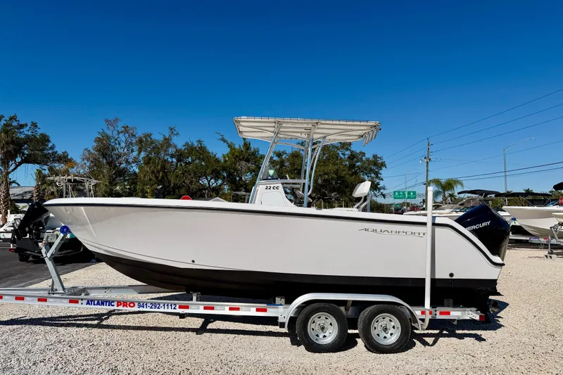 The Image of 2023 Aquasport 2200 Center Console boat on trailer, outdoor display. - 0