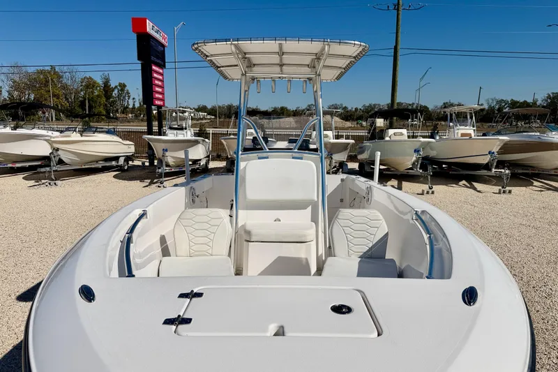 Slide: The Image of 2023 Aquasport 2200 Center Console boat displayed in a dealership lot. - 8