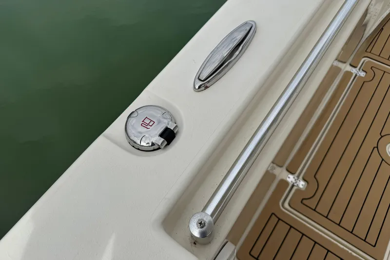 Slide: The Image of 2015 Cobia 344 Center Console boat deck with cleat and fuel cap. - 19