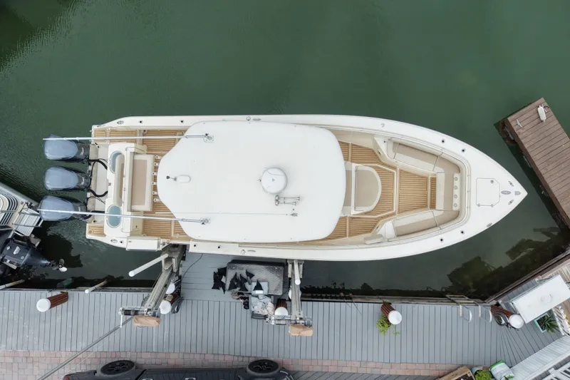 Slide: The Image of Aerial view of 2015 Cobia 344 Center Console boat docked at marina. - 2