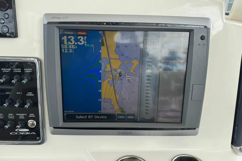 Slide: The Image of Garmin GPS display on 2015 Cobia 344 Center Console boat dashboard. - 25