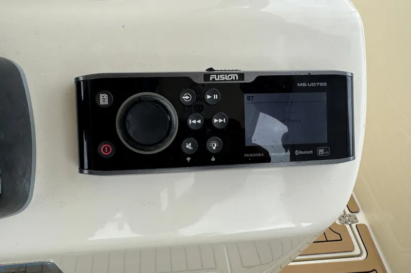 Slide: The Image of Fusion MS-UD755 audio system on 2015 Cobia 344 Center Console boat dashboard. - 28