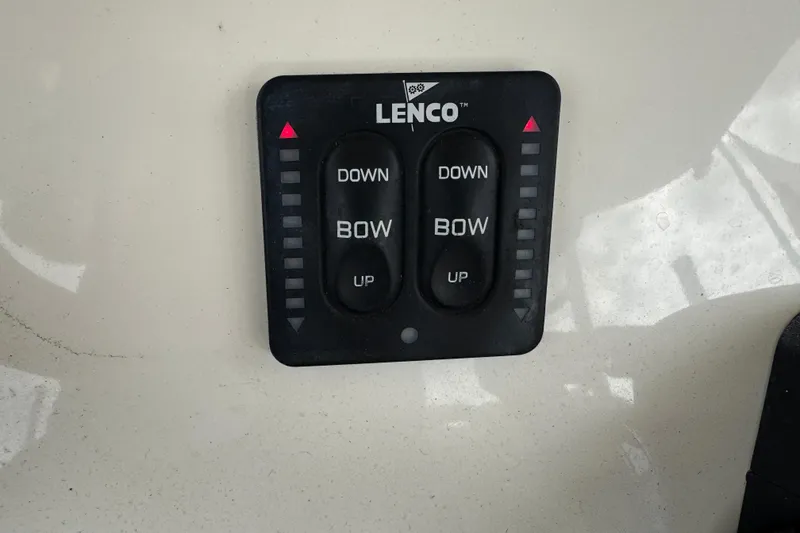 Slide: The Image of Lenco trim tab control panel on 2015 Cobia 344 Center Console boat. - 32