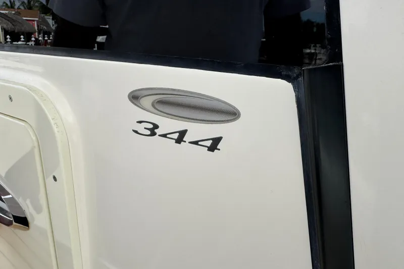 Slide: The Image of 2015 Cobia 344 Center Console boat emblem and model number detail. - 34
