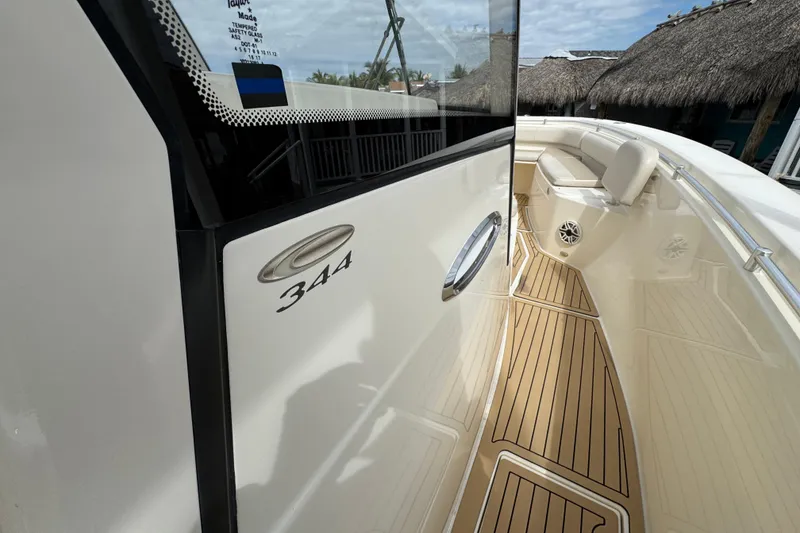 Slide: The Image of 2015 Cobia 344 Center Console boat with teak flooring and sleek design. - 36