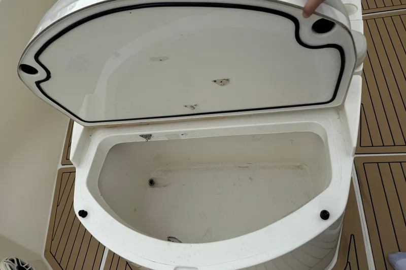 Slide: The Image of Open storage compartment on 2015 Cobia 344 Center Console boat. - 39