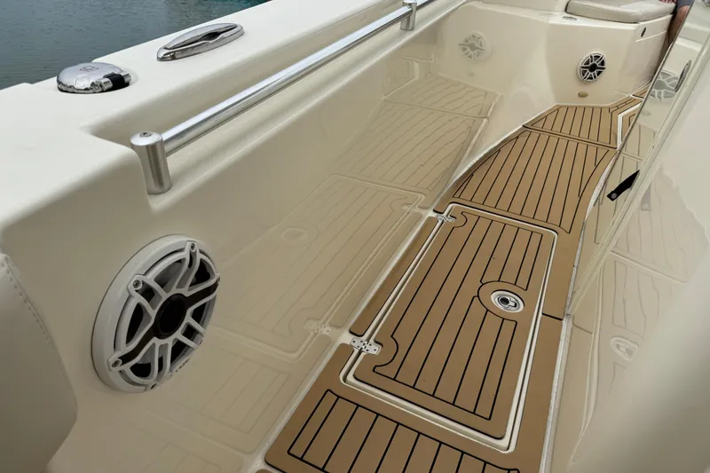 Slide: The Image of 2015 Cobia 344 Center Console boat interior with teak flooring and speaker. - 45