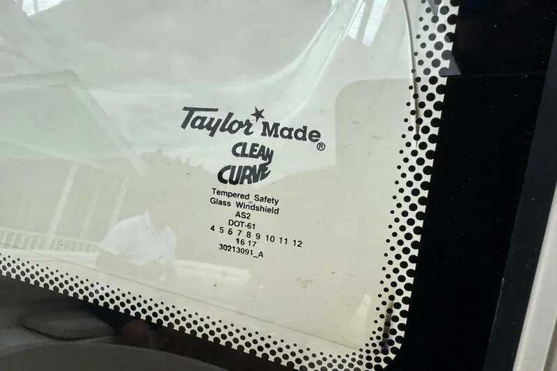 Slide: The Image of Taylor Made Clean Curve tempered safety glass windshield on 2015 Cobia 344 Center Console. - 49