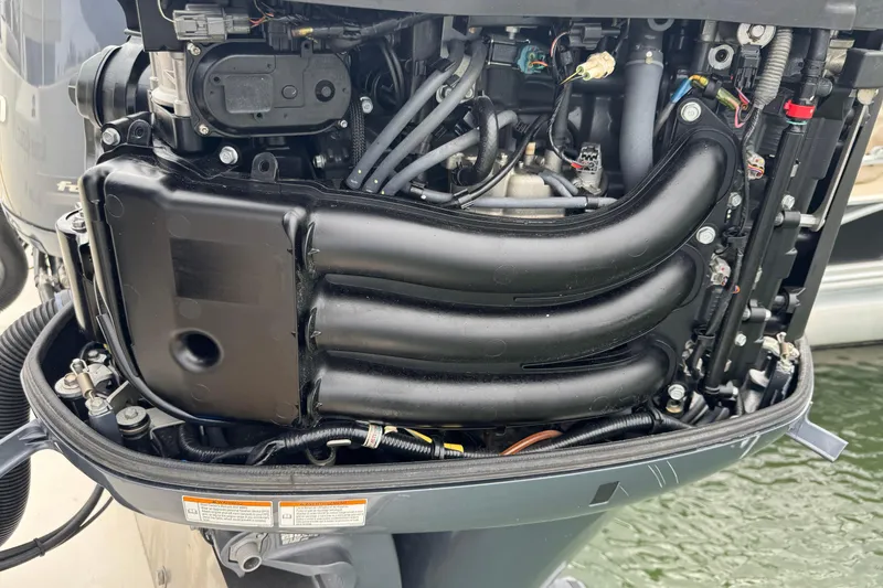 Slide: The Image of 2015 Cobia 344 Center Console engine, detailed view of components and wiring. - 53