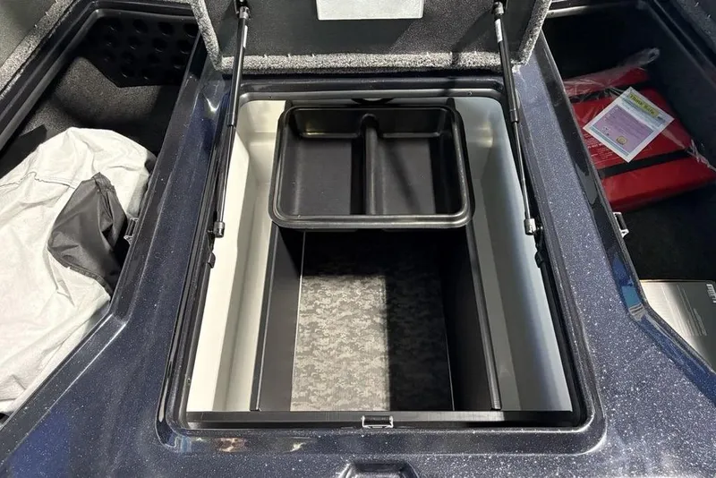 Slide: The Image of Open storage compartment in 2026 Nitro Z19 Pro boat, featuring organized interior space. - 1
