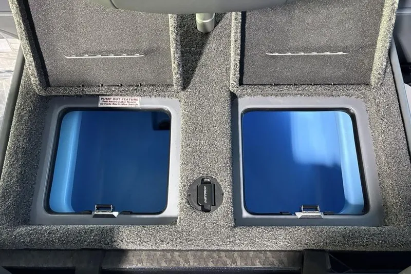 Slide: The Image of 2026 Nitro Z19 Pro boat storage compartments with pump-out feature and carpeted lids. - 17