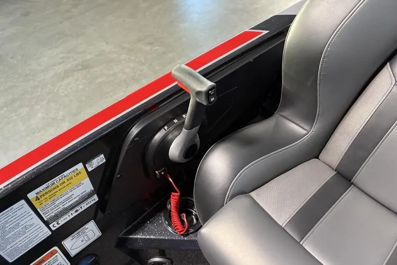 Slide: The Image of Interior of 2026 Nitro Z19 Pro boat with control lever and seat detail. - 18
