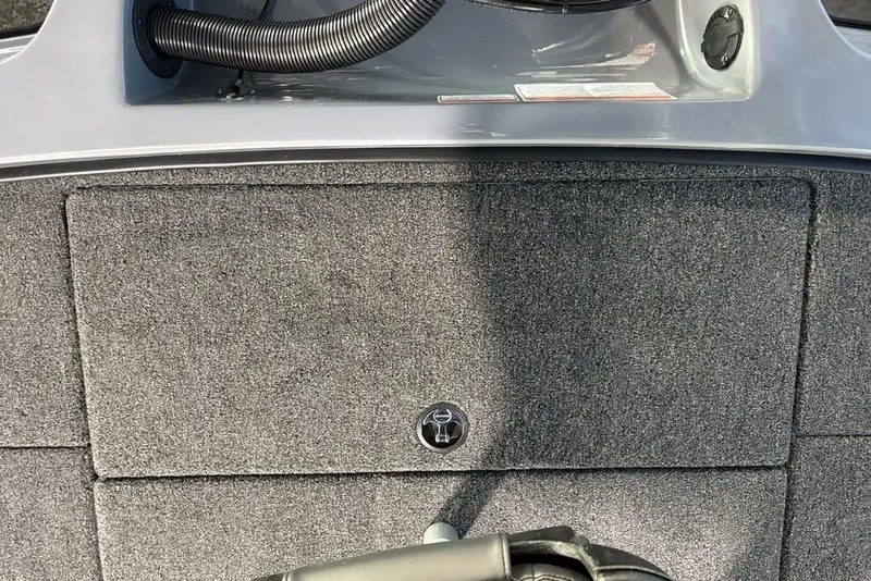 Slide: The Image of Carpeted deck of 2026 Nitro Z19 Pro boat with storage compartment. - 19
