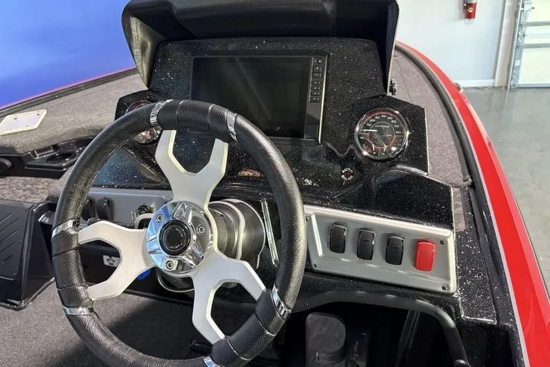 Slide: The Image of Steering console of 2026 Nitro Z19 Pro boat with modern dashboard and controls. - 9