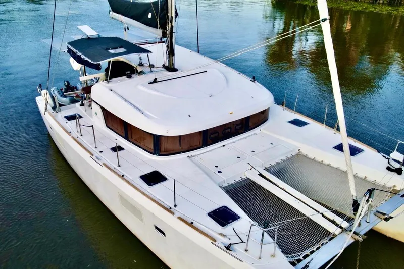 The Image of 2014 Lagoon 39 catamaran on calm water, featuring spacious deck and modern design. - 0