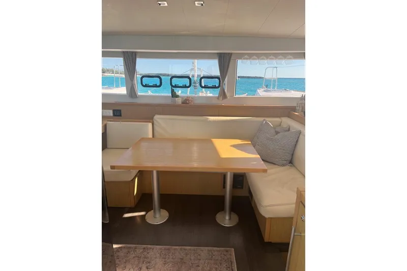 Slide: The Image of Interior of 2014 Lagoon 39 catamaran with dining area and ocean view. - 14