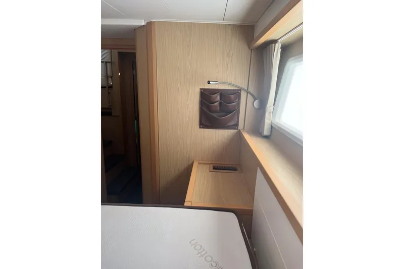 Slide: The Image of Interior cabin of 2014 Lagoon 39 yacht with wooden paneling and window. - 24