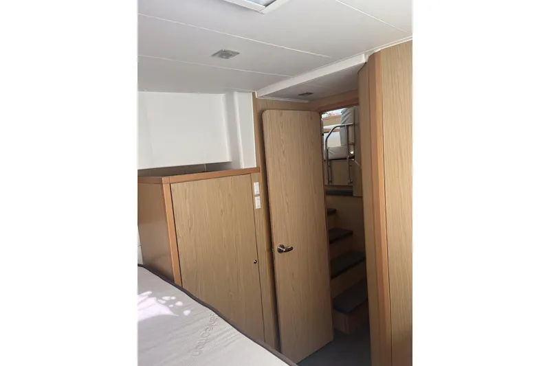 Slide: The Image of Interior of 2014 Lagoon 39 yacht with wooden cabinetry and stairs. - 25