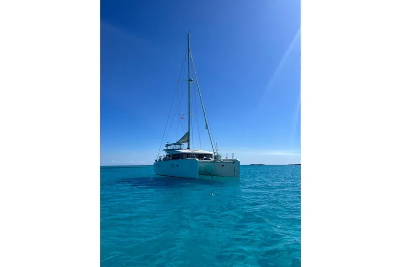 Slide: The Image of 2014 Lagoon 39 catamaran sailing on clear blue ocean under sunny sky. - 3