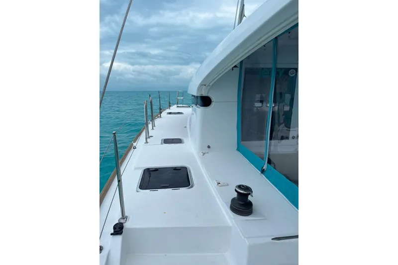 Slide: The Image of 2014 Lagoon 39 catamaran deck with ocean view and cloudy sky. - 5