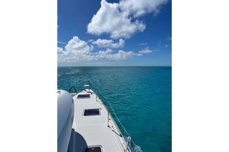 Slide: The Image of Lagoon 39 catamaran sailing on clear blue ocean under a bright sky, 2014 model. - 6