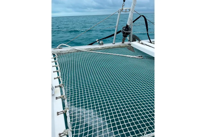 Slide: The Image of Catamaran Lagoon 39 (2014) netting over turquoise ocean waters. - 8