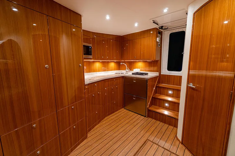 Slide: The Image of Manufacturer Provided Image: Luxurious interior of 2026 Viking 46 Billfish yacht with wooden cabinetry and modern lighting. - 10