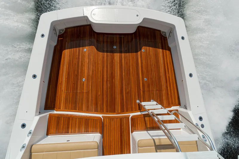 Slide: The Image of Manufacturer Provided Image: 2026 Viking 46 Billfish boat deck with sleek wood finish and modern design. - 2