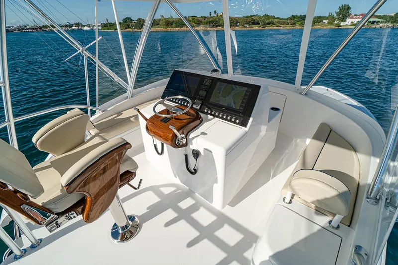 Slide: The Image of Manufacturer Provided Image: Helm of 2026 Viking 46 Billfish yacht with modern controls and seating. - 8